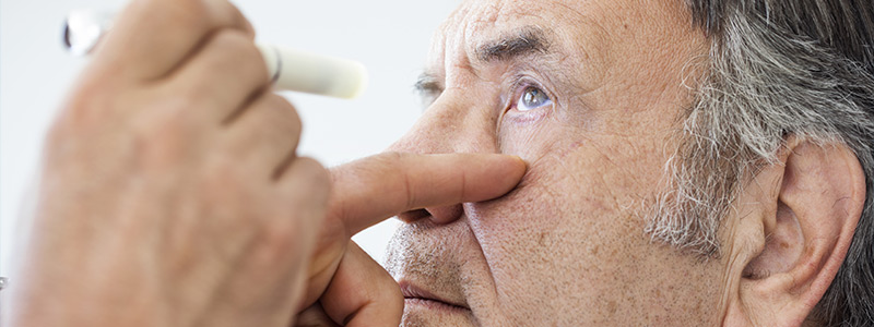 Older man receiving and eye exam