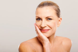 Woman smiling after a cosmetic procedure