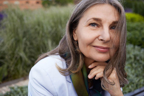 Older woman smiling after cosmetic surgery