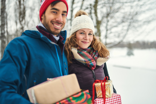 Couple holding gifts 