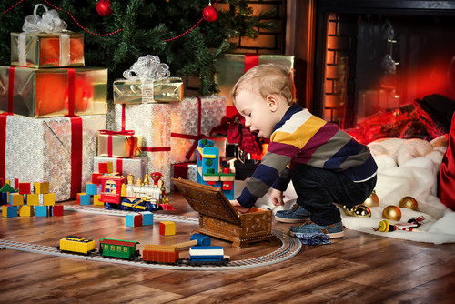 little kid opening up presents