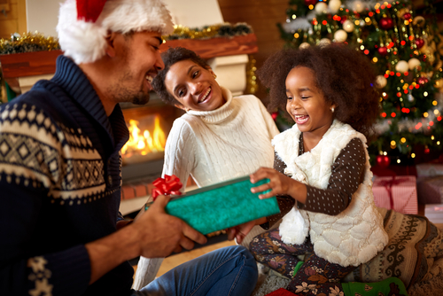 A child receiving a Christmas gift