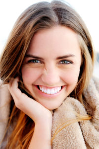 Young woman smiling after LASIK